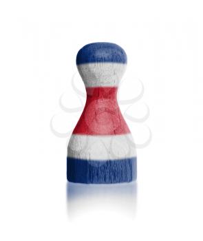 Wooden pawn with a painting of a flag, Costa Rica