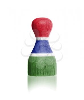 Wooden pawn with a painting of a flag, Gambia