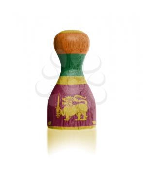 Wooden pawn with a painting of a flag, Sri Lanka