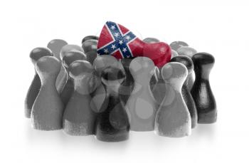 One unique pawn on top of common pawns, confederate flag