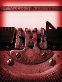 Detail of an old typewriter, bright red