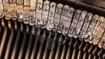 Close-up of an old retro typewriter with paper, warm