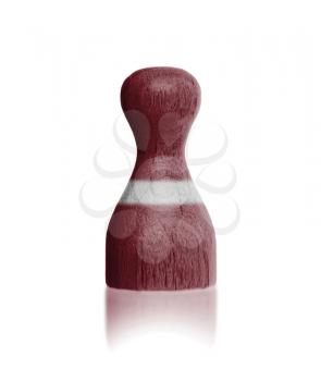 Wooden pawn with a painting of a flag, Latvia