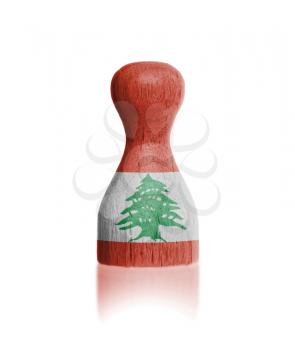 Wooden pawn with a painting of a flag, Lebanon