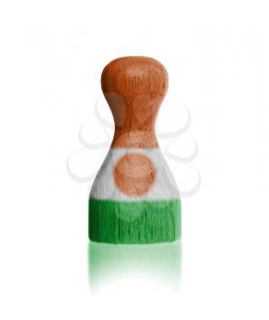 Wooden pawn with a painting of a flag, Niger