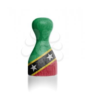 Wooden pawn with a painting of a flag, Saint Kitts and Nevis