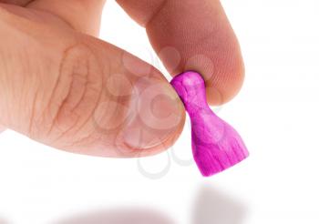 Wooden pawn with a solid color painting, pink