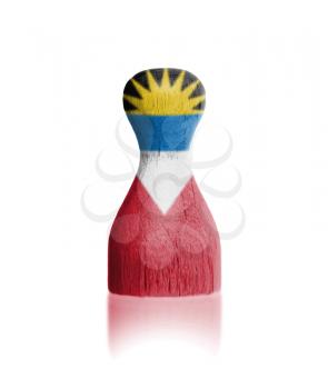 Wooden pawn with a painting of a flag, Antigua and Barbuda