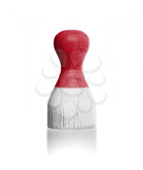 Wooden pawn with a painting of a flag, Indonesia