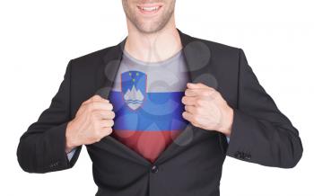 Businessman opening suit to reveal shirt with flag, Slovenia