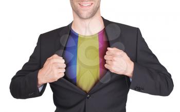 Businessman opening suit to reveal shirt with flag, Romania