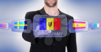 Hand pushing on a touch screen interface, choosing language or country, Moldova