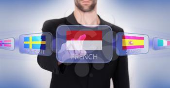 Hand pushing on a touch screen interface, choosing language or country, Monaco