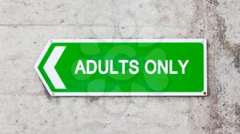 Green sign on a concrete wall - Adults only