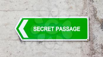 Green sign on a concrete wall - Secret passage