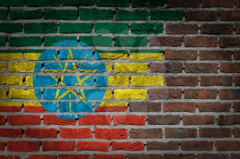 Very old dark red brick wall texture with flag - Ethiopia