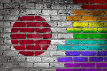 Dark brick wall texture - coutry flag and rainbow flag painted on wall - Japan