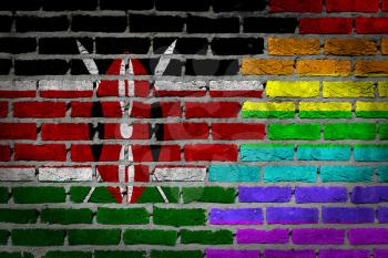 Dark brick wall texture - coutry flag and rainbow flag painted on wall - Kenya
