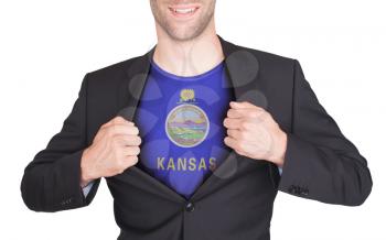 Businessman opening suit to reveal shirt with state flag (USA), Kansas