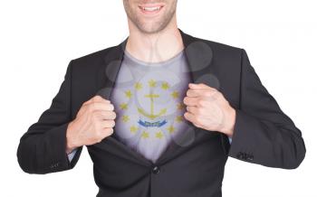 Businessman opening suit to reveal shirt with state flag (USA), Rhode Island