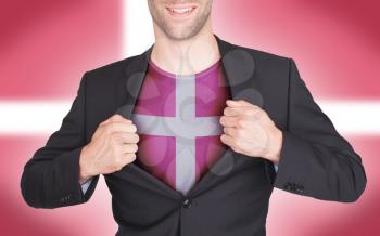 Businessman opening suit to reveal shirt with flag, Denmark