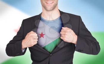 Businessman opening suit to reveal shirt with flag, Djibouti