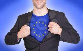 Businessman opening suit to reveal shirt with flag, European Union