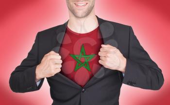 Businessman opening suit to reveal shirt with flag, Morocco