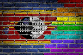 Dark brick wall texture - coutry flag and rainbow flag painted on wall - Swaziland