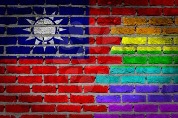 Dark brick wall texture - coutry flag and rainbow flag painted on wall - Taiwan