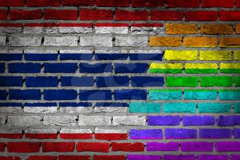 Dark brick wall texture - coutry flag and rainbow flag painted on wall - Thailand