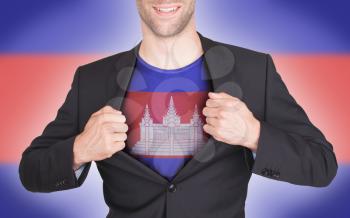 Businessman opening suit to reveal shirt with flag, Cambodia