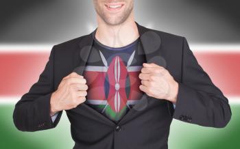 Businessman opening suit to reveal shirt with flag, Kenya