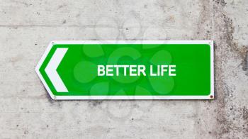 Green sign on a concrete wall - Better life