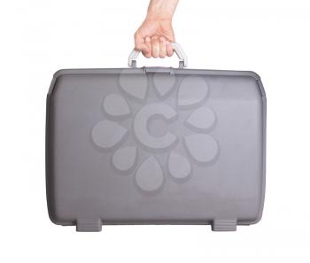 Used plastic suitcase with stains and scratches, isolated