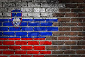 Very old dark red brick wall texture with flag - Slovenia