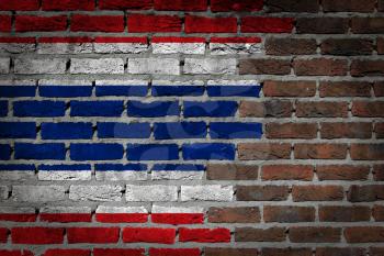 Very old dark red brick wall texture with flag - Thailand