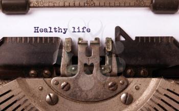 Vintage inscription made by old typewriter, healthy life