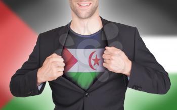 Businessman opening suit to reveal shirt with flag, Western Sahara