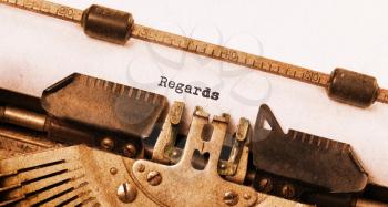 Vintage typewriter, old rusty, warm yellow filter - Regards