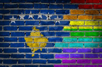 Dark brick wall texture - coutry flag and rainbow flag painted on wall - Kosovo