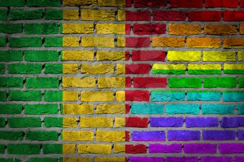Dark brick wall texture - coutry flag and rainbow flag painted on wall - Mali