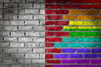 Dark brick wall texture - coutry flag and rainbow flag painted on wall - Malta