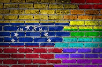 Dark brick wall texture - coutry flag and rainbow flag painted on wall - Venezuela