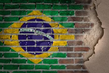 Dark brick wall texture with plaster - flag painted on wall - Brazil