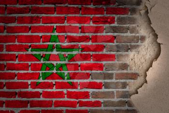 Dark brick wall texture with plaster - flag painted on wall - Morocco