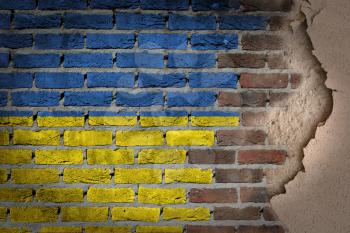 Dark brick wall texture with plaster - flag painted on wall - Ukraine