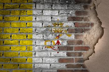 Dark brick wall texture with plaster - flag painted on wall - Vatican
