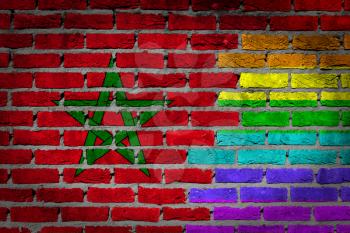 Dark brick wall texture - coutry flag and rainbow flag painted on wall - Morocco
