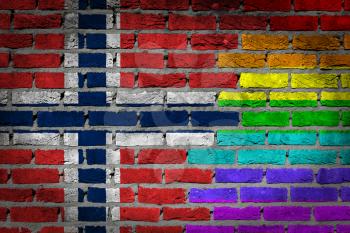 Dark brick wall texture - coutry flag and rainbow flag painted on wall - Norway